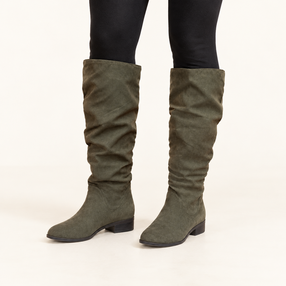 Kelly & Katie green slouch boots styled with black leggings